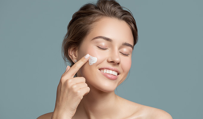 happy-woman-skincare-apply-1.jpg
